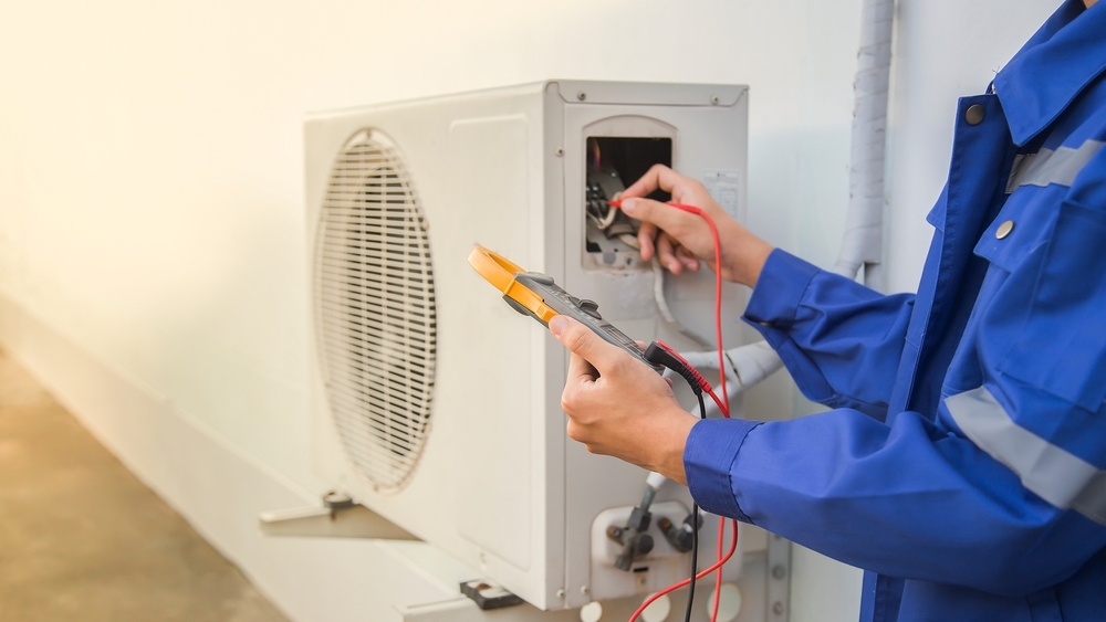 Ac Technician Checking The Operation Of The Air Conditioner System