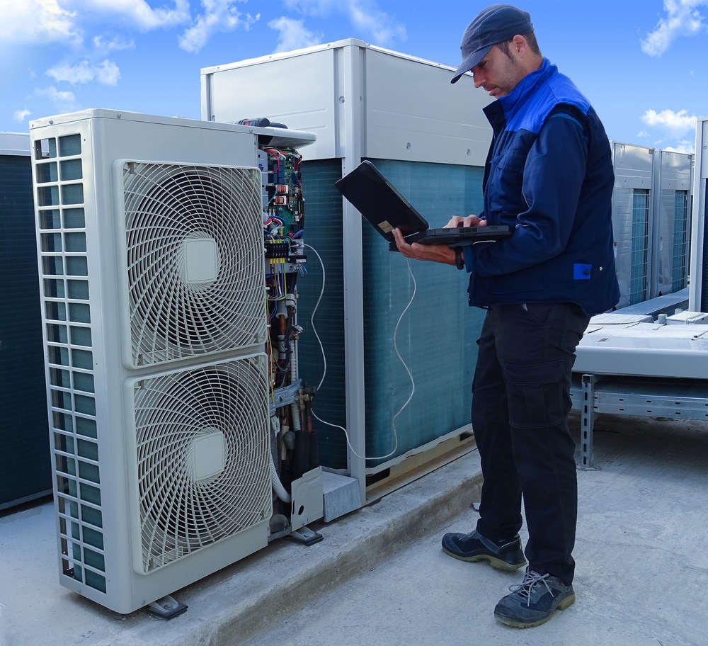 Expert Technician Performing An Ac Tune Up Commercial Unit